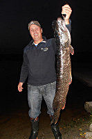 Fisherman with a pike